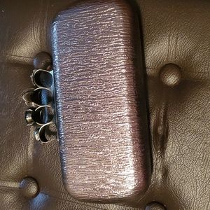 Silver skull detail clutch
